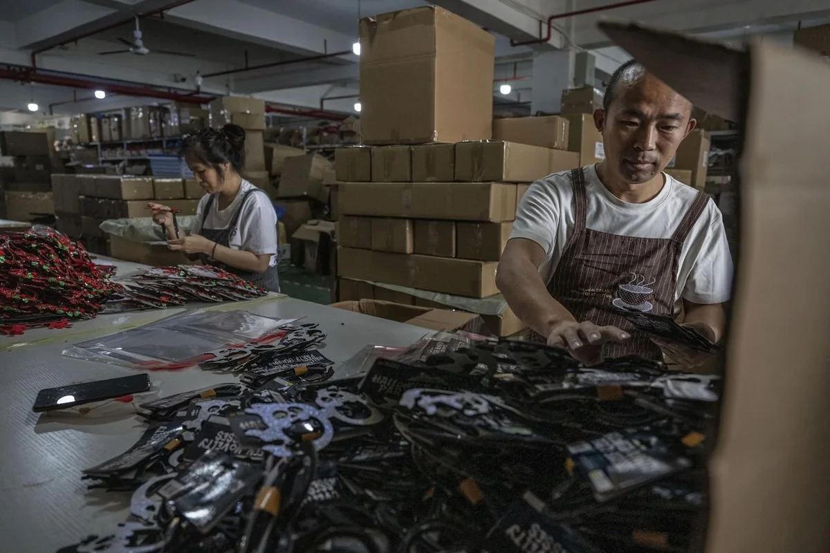 Team members assembling and organizing seasonal party products at a worktable