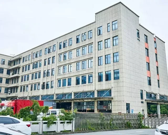 Exterior view of a multi-story factory building