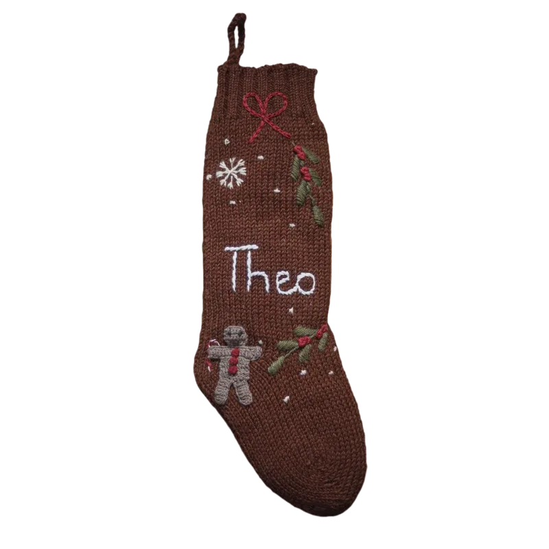 Brown personalized knit Christmas stocking with gingerbread and winter motifs