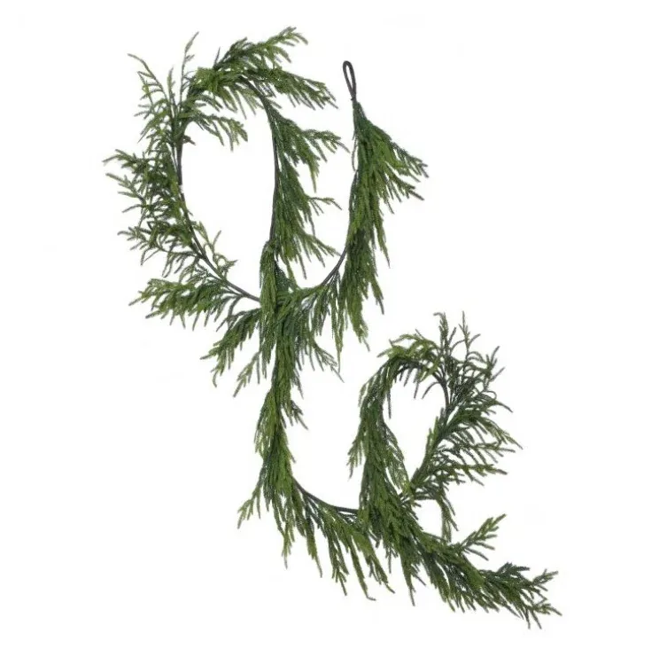 Complete cascading evergreen garland arranged in loops on a white background