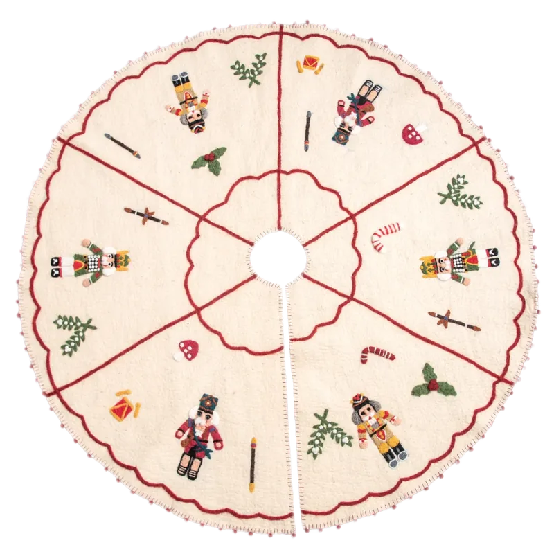 Round cream Christmas tree skirt with nutcracker and holiday motifs