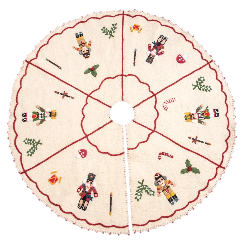 Round cream Christmas tree skirt with nutcracker and holiday motifs