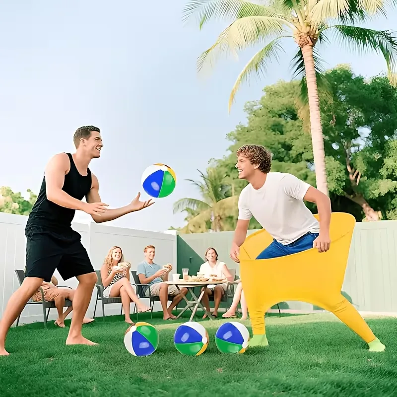 Two adults playing a wearable ball catch game on a backyard lawn